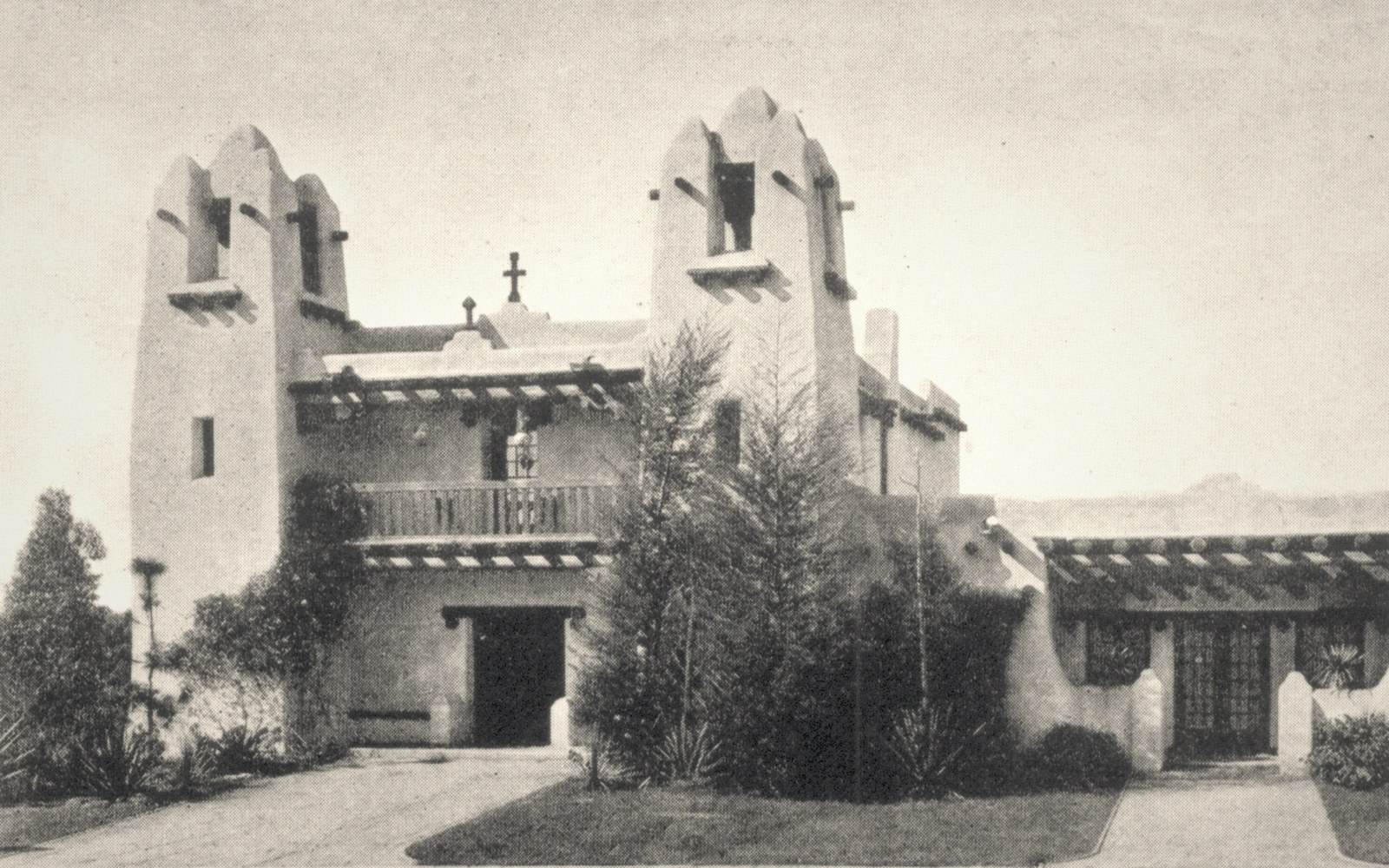 A shaded courtyard with worn glazed tilework